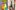 Person painting vibrant canvas with brush, watercolor palette, and jar on hexagonal tiles.