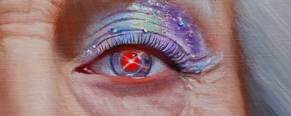 Close-up of an eye with purple, blue, green eyeshadow and a red reflective element in the pupil.